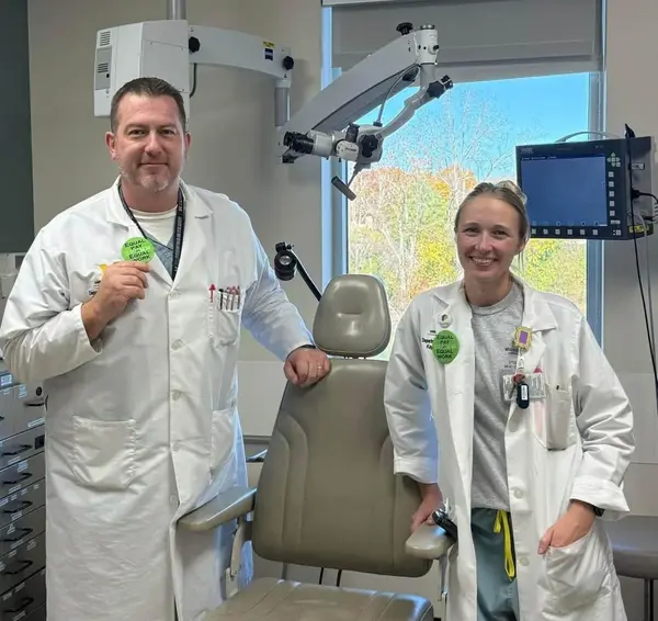 Two Physician Assistants in a clinic setting.